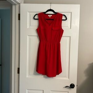Red sleeveless dress by Monteau with built-in slip. Size medium.